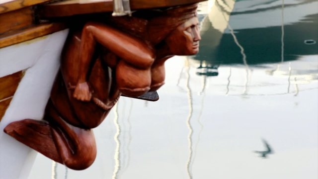 Wooden mermaid on the boat