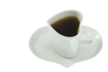 coffee poured into a heart-shaped coffee cup