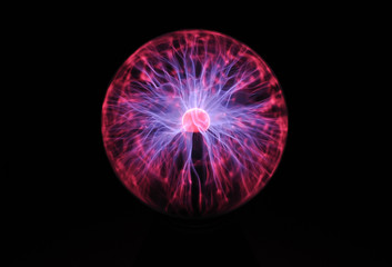 close up on purple and red glows in glass plasma lamp
