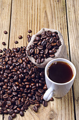 Coffee beans and coffee cup