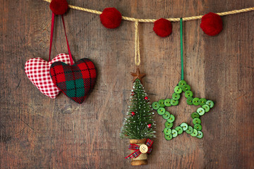 Christmas ornaments hanging on wood background