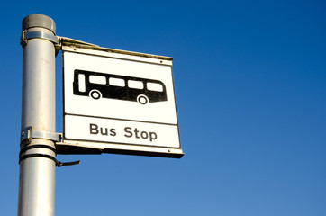 bus stop sign on blue background