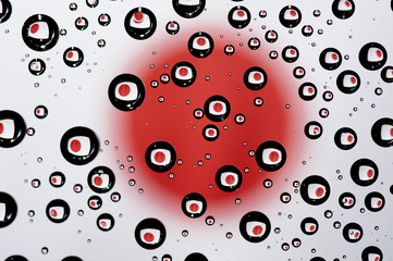 Reflection of Japan flag in water droplets