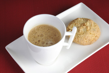 Cup of delicious coffee and biscuits