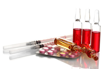 medical ampules, pills and syringes, isolated on white