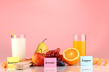 Dietary foods for breakfast, dinner and supper on red