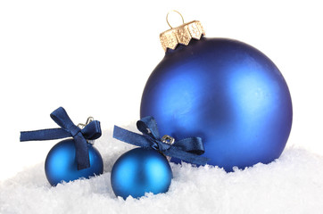beautiful blue Christmas balls on snow, isolated on white