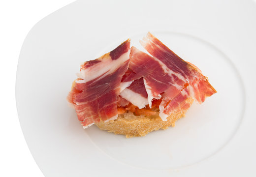 Spanish tapa, ham and tomato