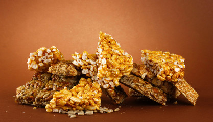 tasty sweets (kozinaki), on brown background