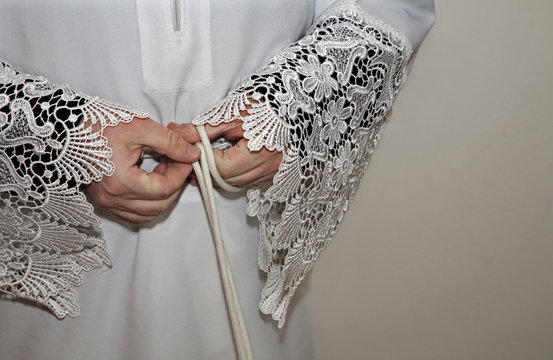 hands of cathlic pirest at dressing for the tridentine mass