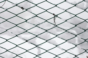 Fence covered by snow - background