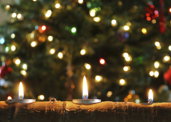 A Trio of Christmas Candles in an Aspen Log - 47720684
