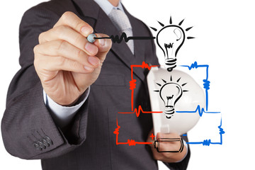 engineer hand draws electrical diagram