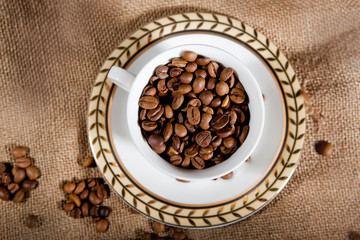 a cup with coffee beans