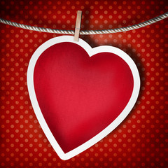 Valentine background: heart hanging on clothespin