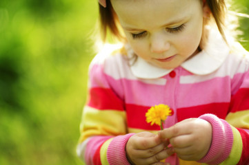 cute little girl with dandelion