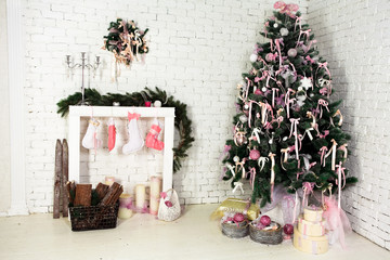 Nice Christmas interior with a fir-tree, fireplace and gifts