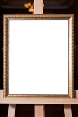 wooden gold picture frame on easel