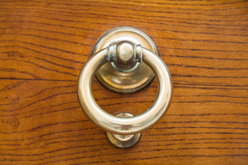 old brass ring door handle