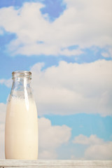 bread, milk, butter on a background of the sky - a picnic