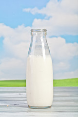 bread, milk, butter on a background of the sky - a picnic