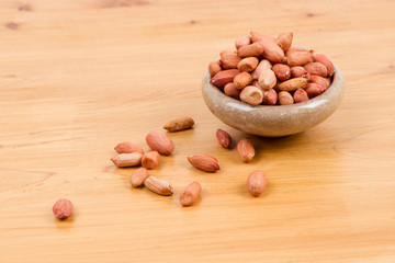 Peanuts in bowl on the table