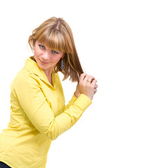 woman wearing a yellow shirt posing