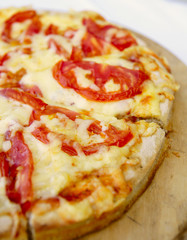 Pizza with cheese and tomatoes