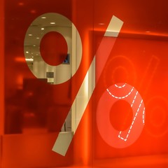 Percent sign on a red background on a shop window