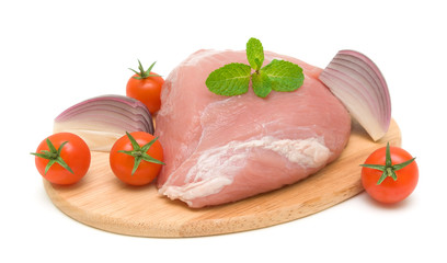 meat and vegetables on a cutting board on a white background