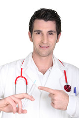 Doctor holding a needle
