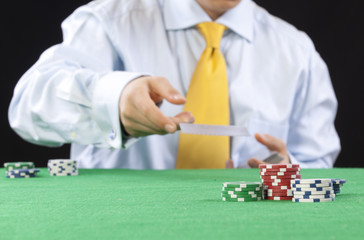 poker player  with a yellow tie serving cards
