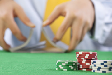 Naklejka premium Two hands, shuffling a deck of cards of poker 