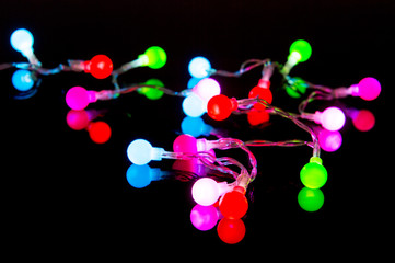Colorful Christmas lights on black