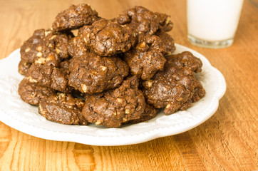 Plate of chocolate cookies on white plate