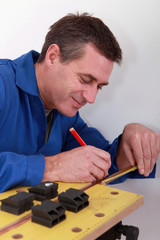 Man measuring tube