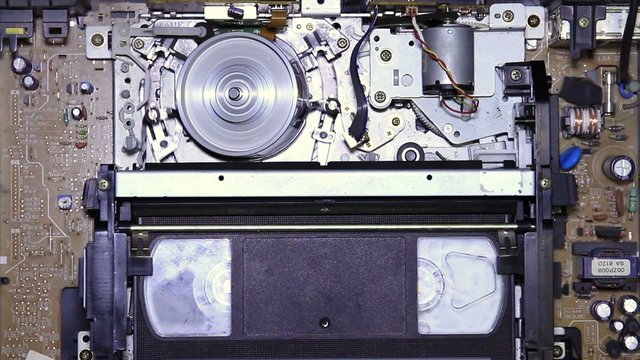 VHS tape inserted into VCR inside vision