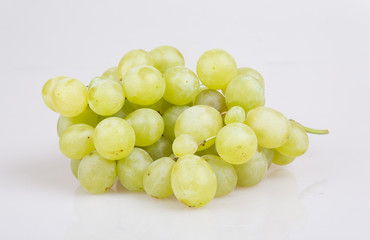 Fresh green grapes. Isolated on white