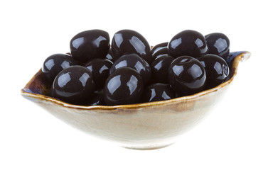 Olives black watered with olive oil in a bowl isolated on a whit