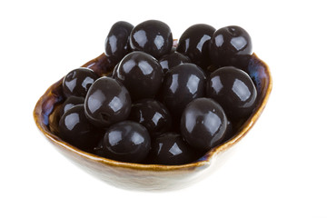 Olives black watered with olive oil in a bowl isolated on a whit