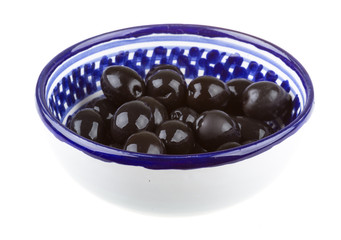 Olives black watered with olive oil in a bowl isolated on a whit