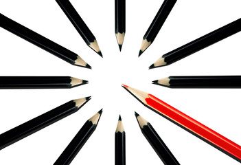 Red pencil among black pencils