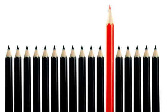 Red pencil among black pencils
