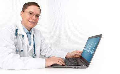 Fototapeta na wymiar male doctor working on a laptop