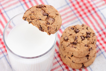 Cookie pile and fresh milk on table