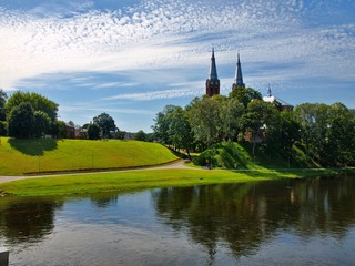 Church in Anyksciai city and beautiful river Sventoji - obrazy, fototapety, plakaty