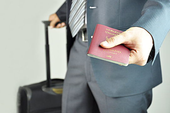 Businessman handing passport
