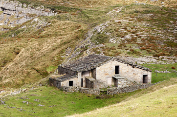 shepherd's hut made of rock in the mountains