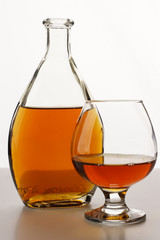 Bottle of cognac and cognac glass