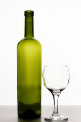 Empty wine bottle and wine glass